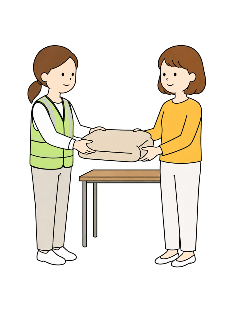 Woman receiving blanket at emergency shelter