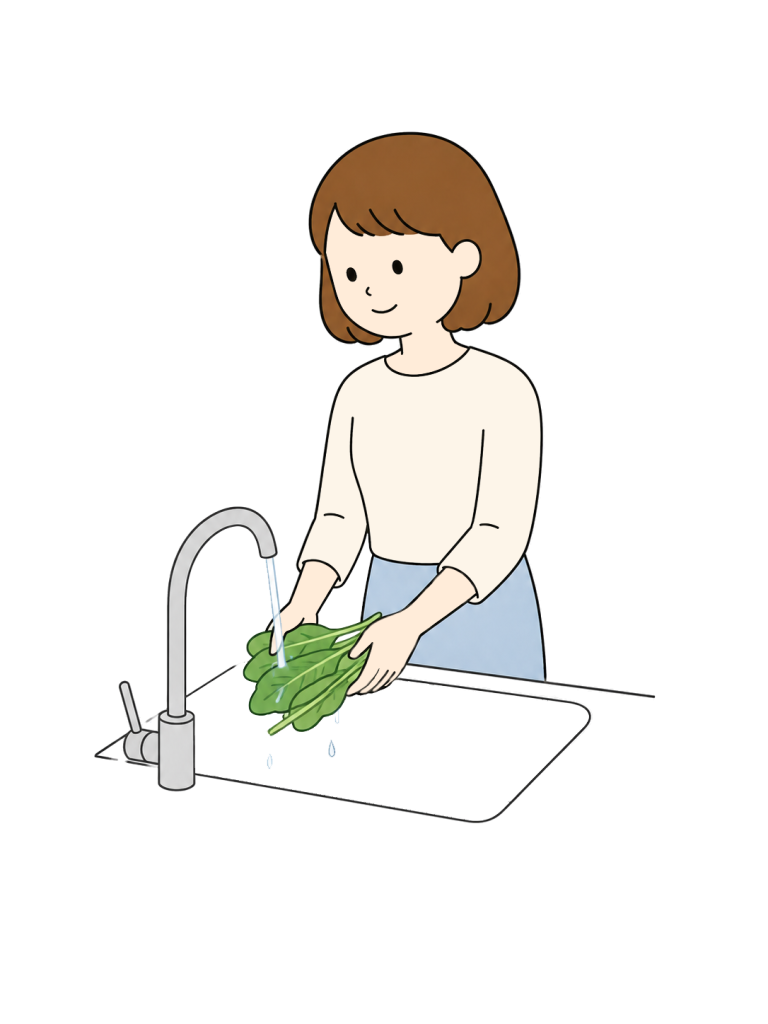 Woman washing vegetables