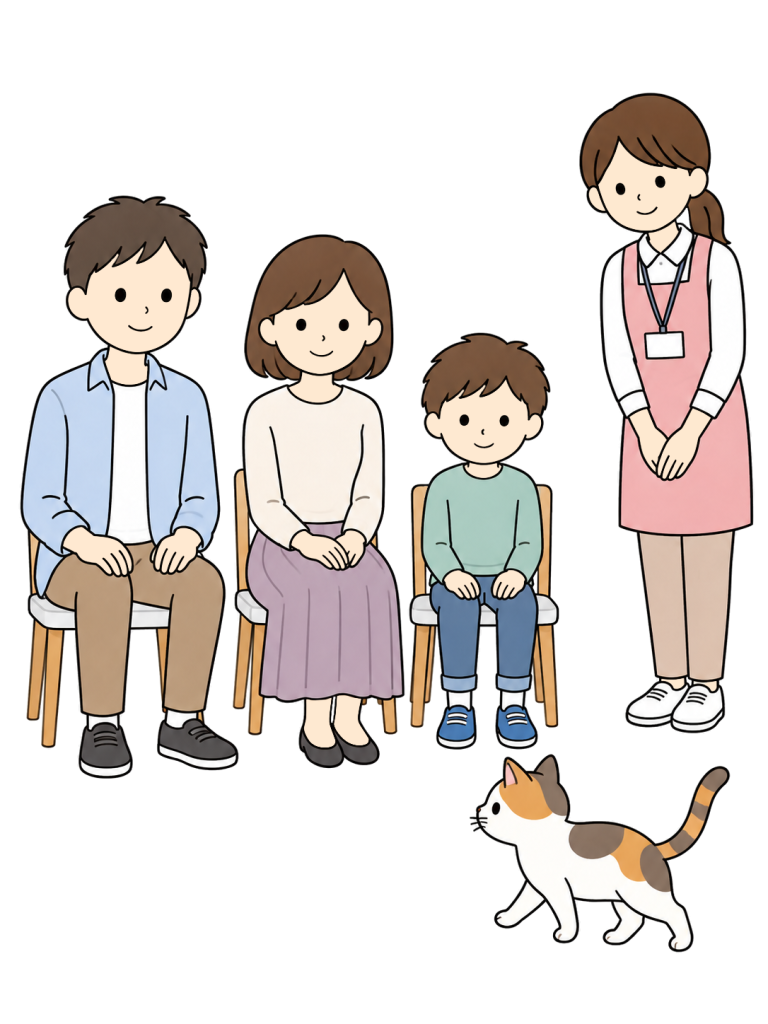 Family quietly waiting for a cat to approach at an adoption event