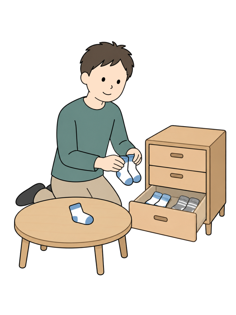 Father pairing and putting away a childs socks