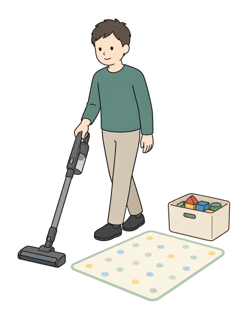 Father vacuuming a childs play area