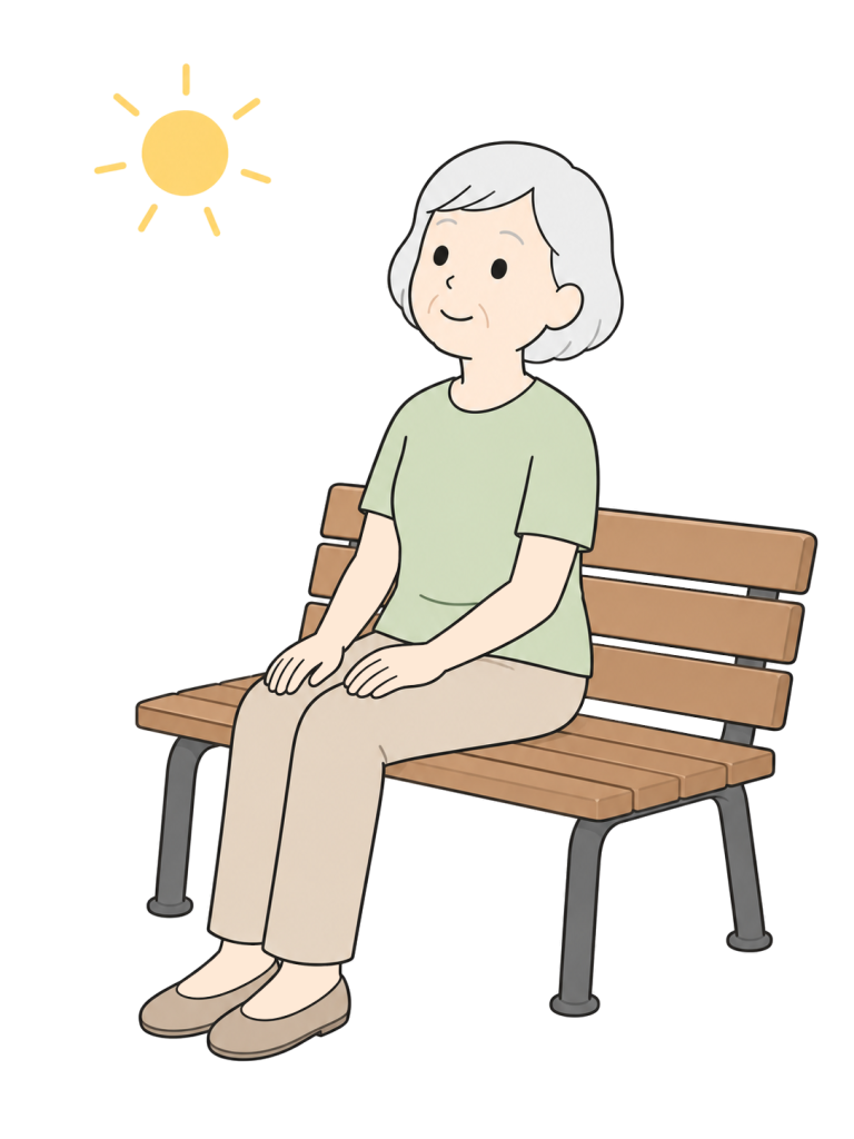 高齢女性がベンチに座って穏やかに顔を上げている。そばに日差しを表す太陽の記号がある。